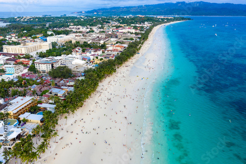 Aerial view of a crowded beach as people gather to watch sunset (Boracay Island, Philippines) © whitcomberd
