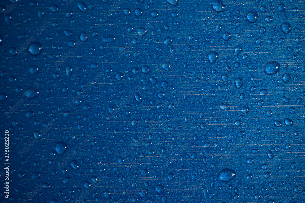 Drops of water on a blue background. Abstract background.