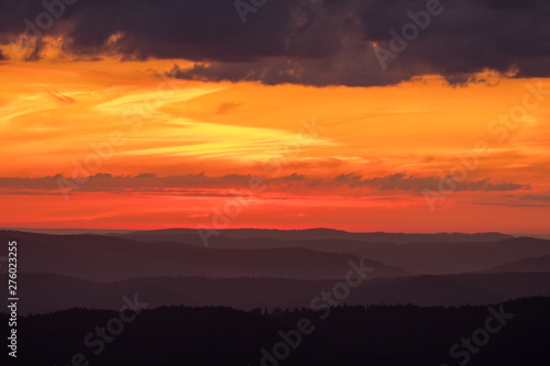 Orange sky, clouds and mountains. Beautiful sunrise in the Bieszczady mountains. Poland © Szymon Bartosz