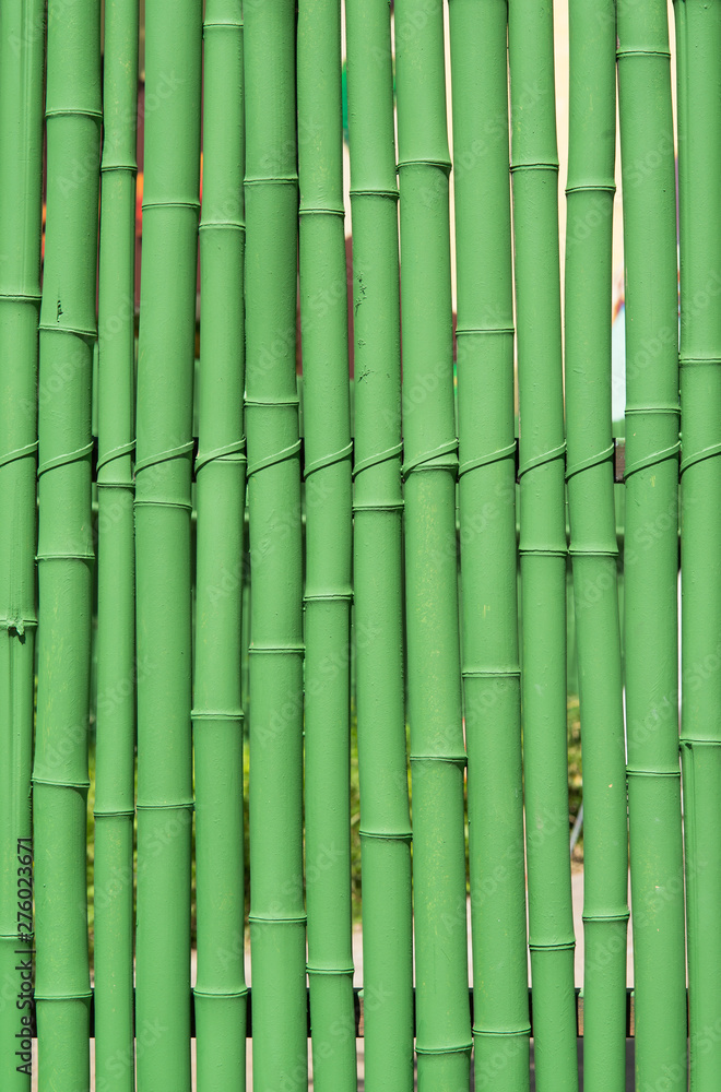 Green-painted bamboo fence, texture pattern abstract for background. Green-painted bamboo fence, texture pattern abstract for background.