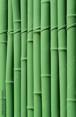 Fototapeta Naklejka Na Ścianę i Meble -  Green-painted bamboo fence, texture pattern abstract for background. 