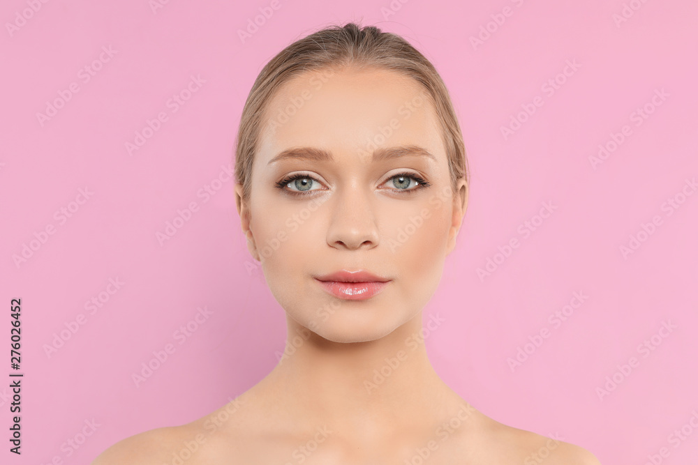 Portrait of young woman with beautiful face on pink background Portrait of young woman with beautiful face on pink background