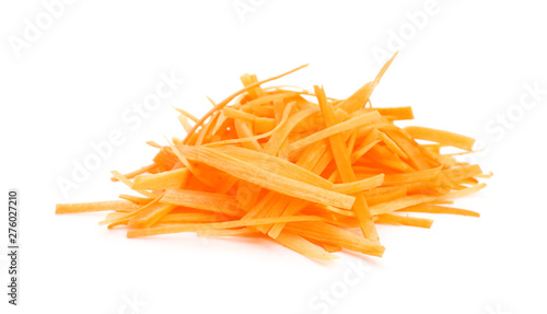 Grated fresh ripe carrot on white background