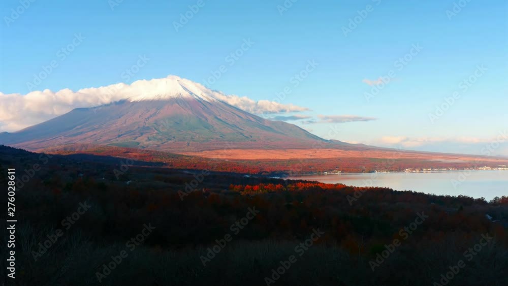 Outstanding time lapse of Mount Fuji illuminated by the red light of sunset Outstanding time lapse of Mount Fuji illuminated by the red light of sunset