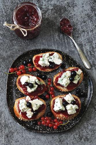 Toasts with currant jam and blue cheese.
