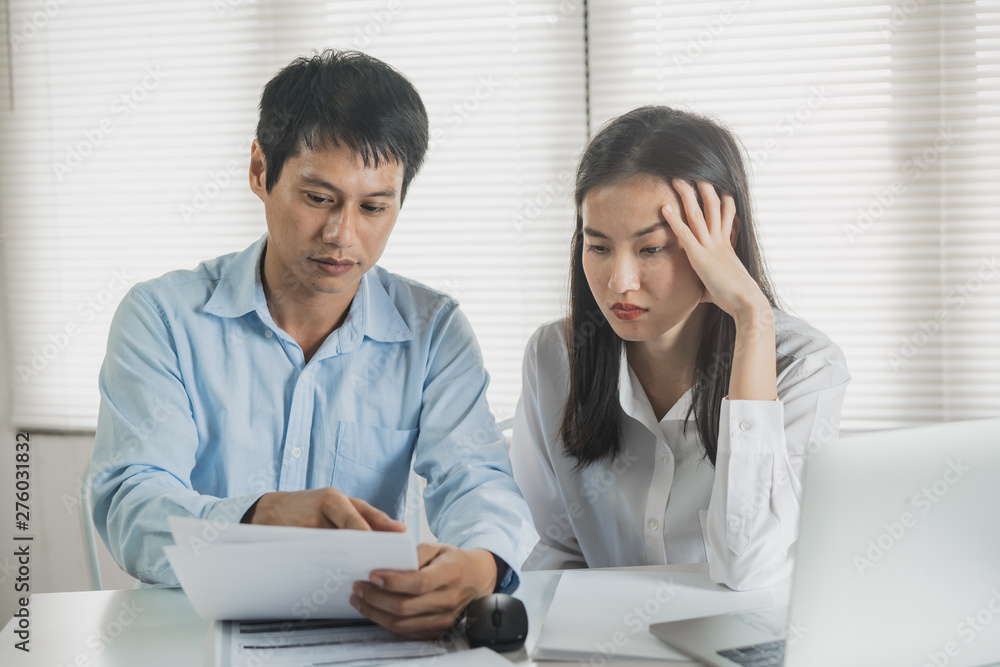 Stressed couple worrying about payment credit debt. Stressed couple worrying about payment credit debt.