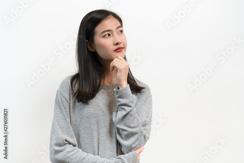 Asian young woman thoughtful thinking isolated on white back ground in studio.