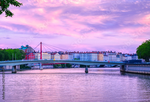 Fototapeta Naklejka Na Ścianę i Meble -  A view of Lyon, France along the Saône river at sunset.