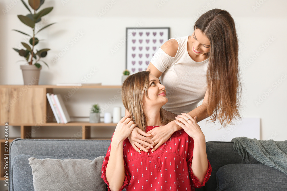 Portrait of happy mother and daughter at home Portrait of happy mother and daughter at home