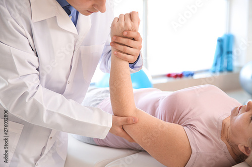 Physiotherapist working wit...