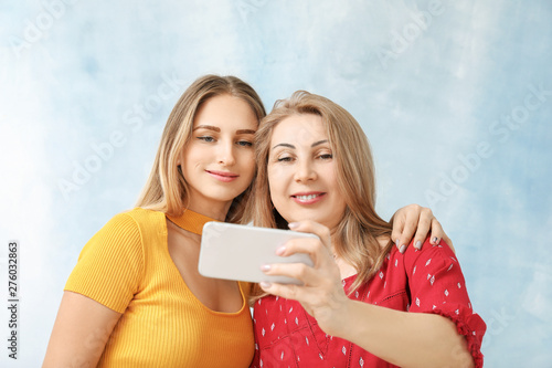 Portrait of happy mother an...