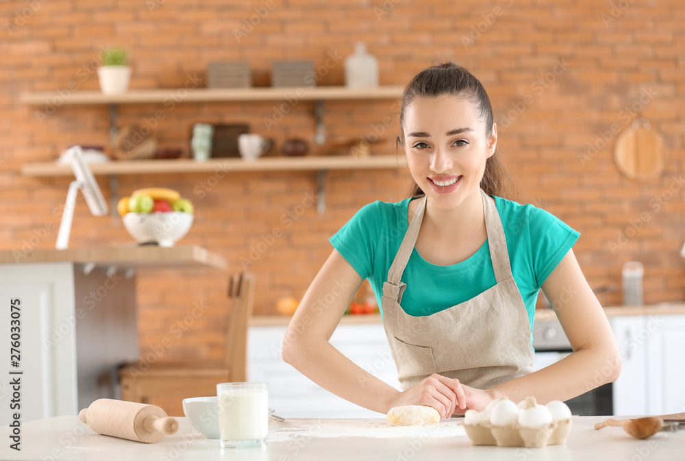 Beautiful woman preparing bakery in kitchen at home Beautiful woman preparing bakery in kitchen at home