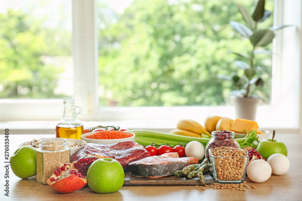 Different healthy food on table in kitchen Different healthy food on table in kitchen