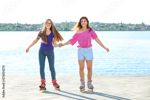 Teenagers on roller skates ...