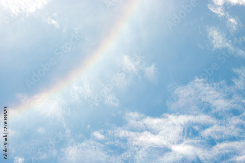 Rainbow on Blue sky with white cloud © tanapon
