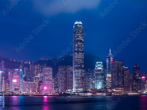 Hong Kong skyline at night with lights from the building.