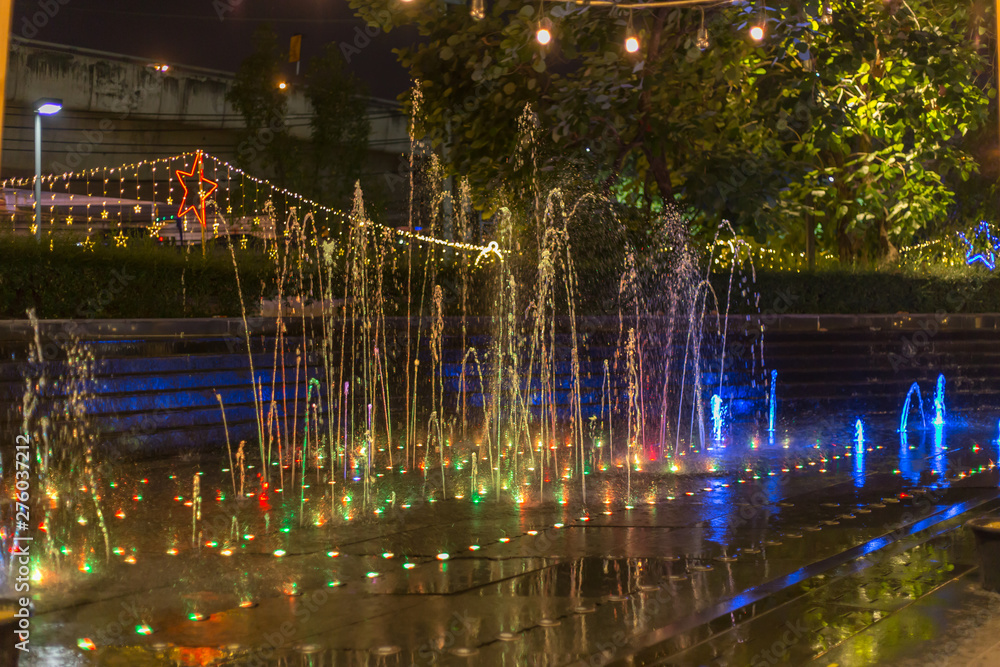 Water and colorful lights at night 
