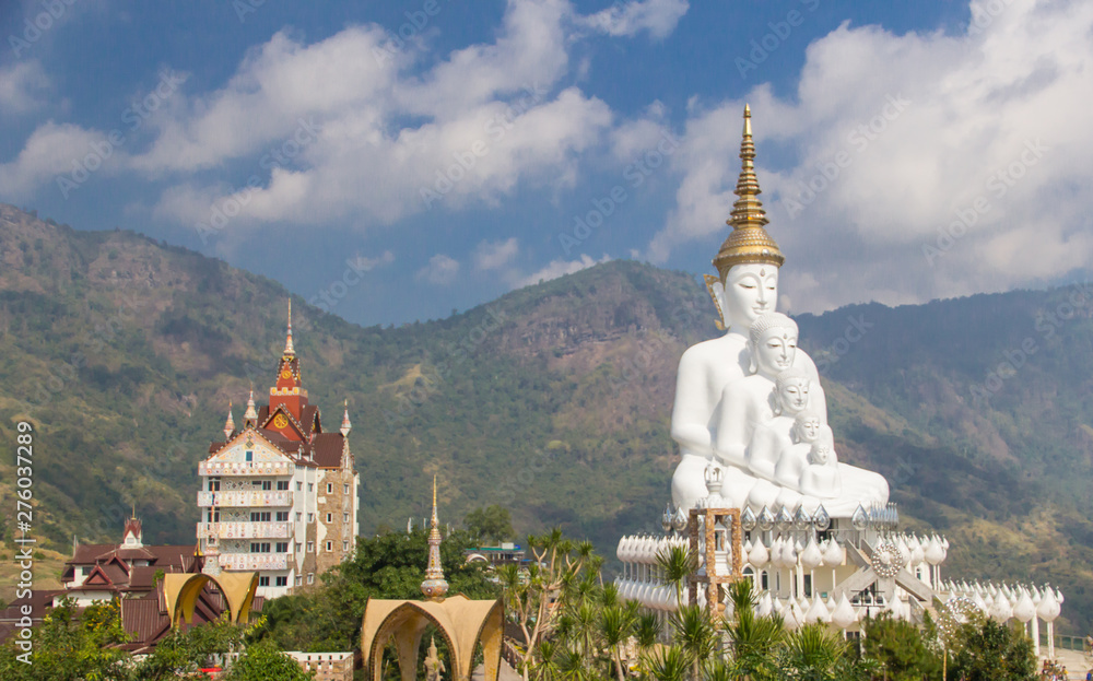 5 Buddha images, white, mountain and sky background images At Pha Hid Kaew Temple, Thailand