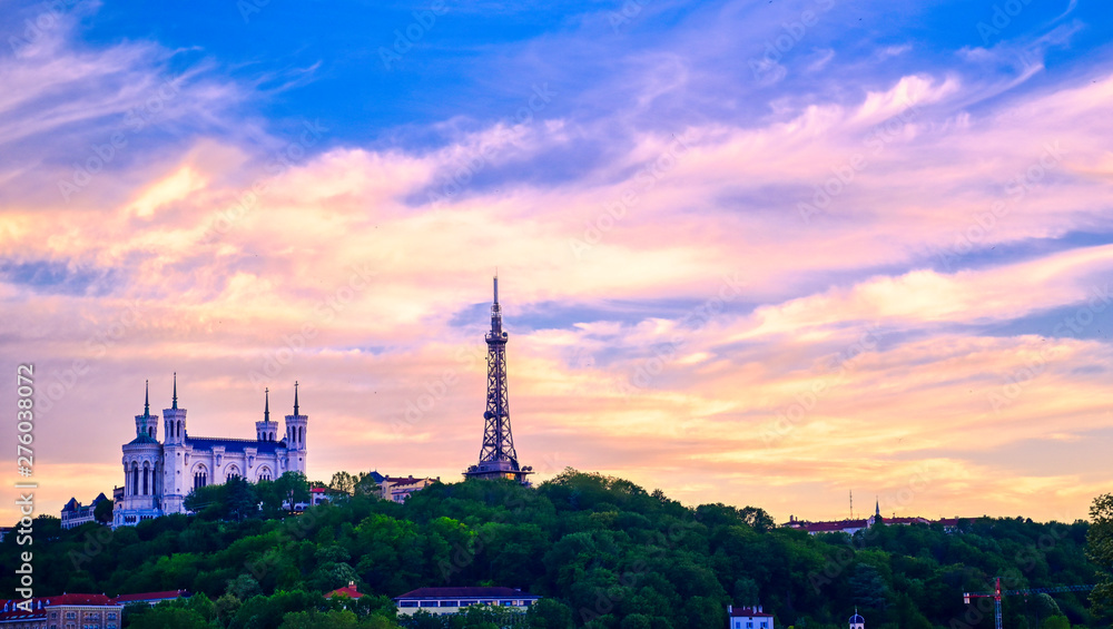 Lyon, France and the Basilica of Notre-Dame de Fourvière at sunset.