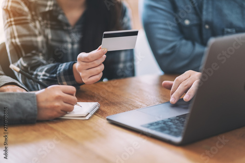 Businessman using credit card for purchasing and shopping online