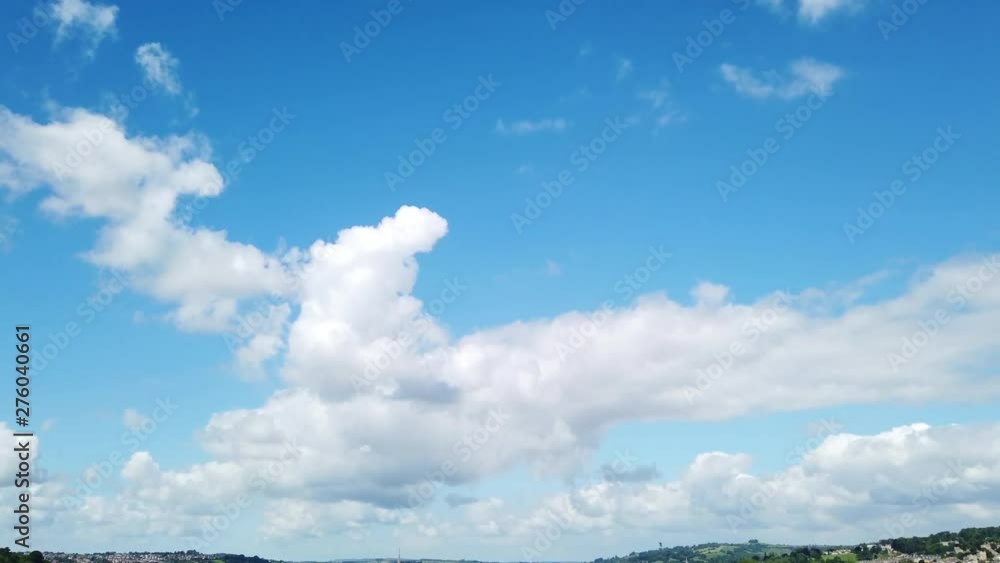 Shot of the City of Bath Skyline from Hillside Lookout on a Sunny Summer’s Day Fading In from Blue Sky with White Fluffy Clouds Shot of the City of Bath Skyline from Hillside Lookout on a Sunny Summer’s Day Fading In from Blue Sky with White Fluffy Clouds