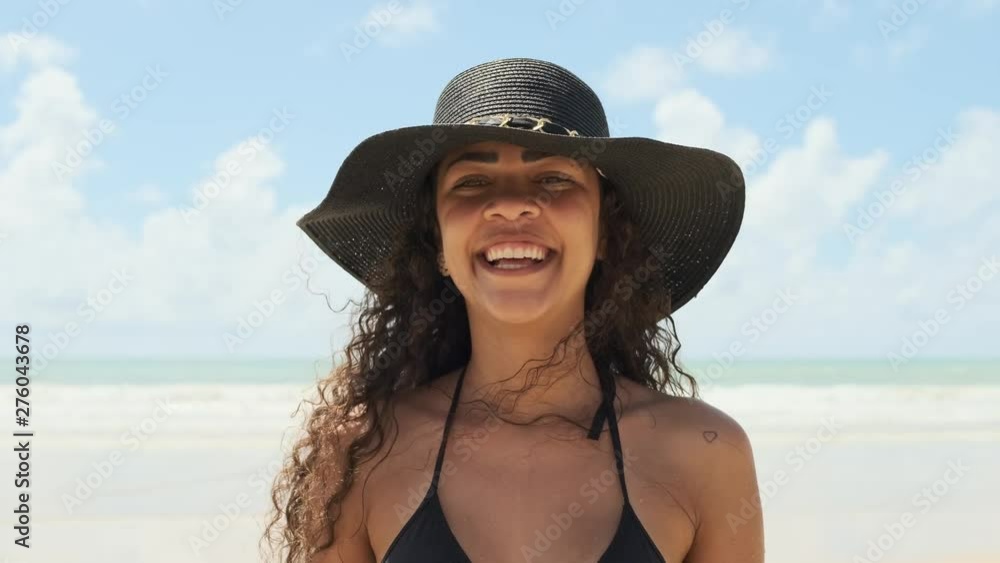 Young latin woman walking on beach. Beautiful female happy relax walking on beach near sea when sunset in evening. Lifestyle women travel on beach concept. Young latin woman walking on beach. Beautiful female happy relax walking on beach near sea when sunset in evening. Lifestyle women travel on beach concept.