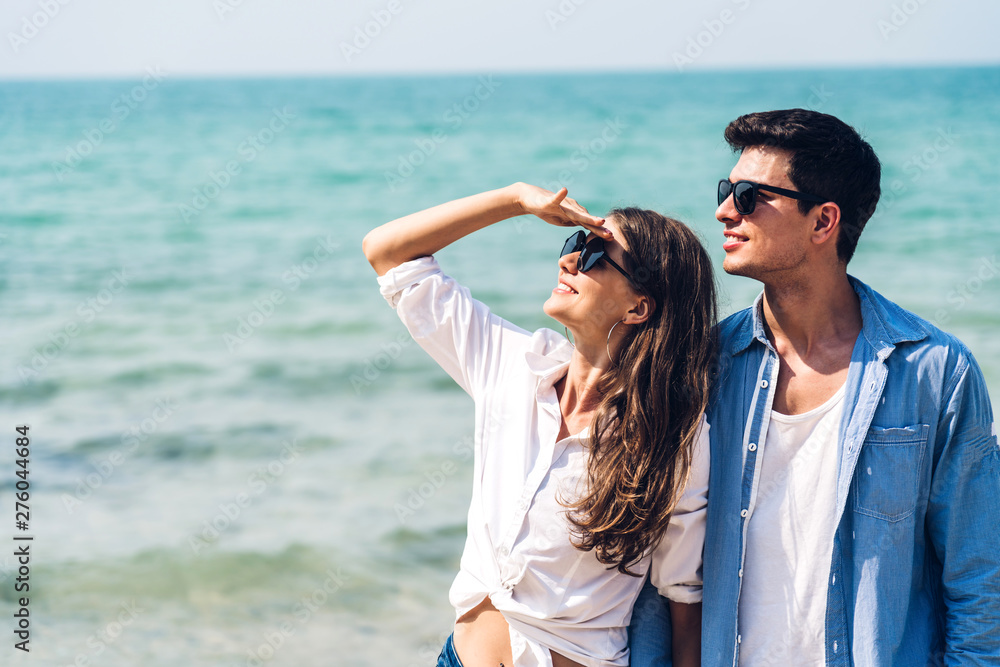 Romantic lovers young couple relaxing together on the tropical beach.Summer vacations