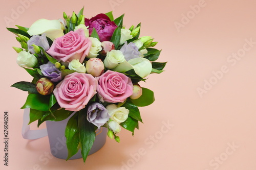 Flower composition in a stylish hat box. Concept of flower shop. Colorful bouquet of flowers in a cachepot. Postcard with flowers. © Victoria