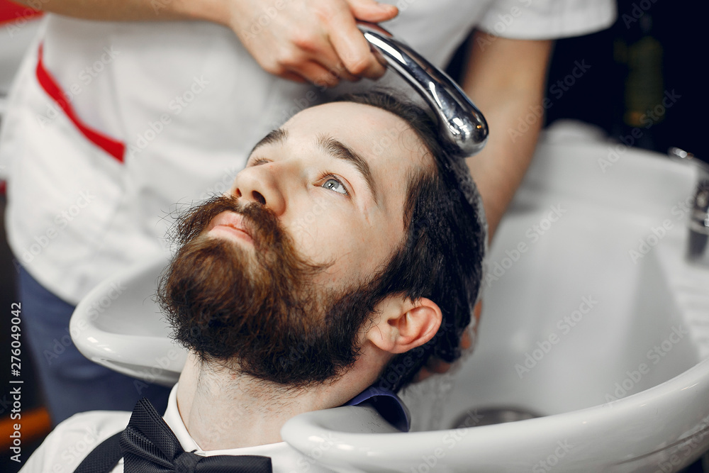 Man with a beard. Hairdresser with a client. Man with a beard. Hairdresser with a client.