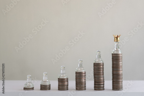 Coin stacks arranged into growth chart on white background, finance and business concept