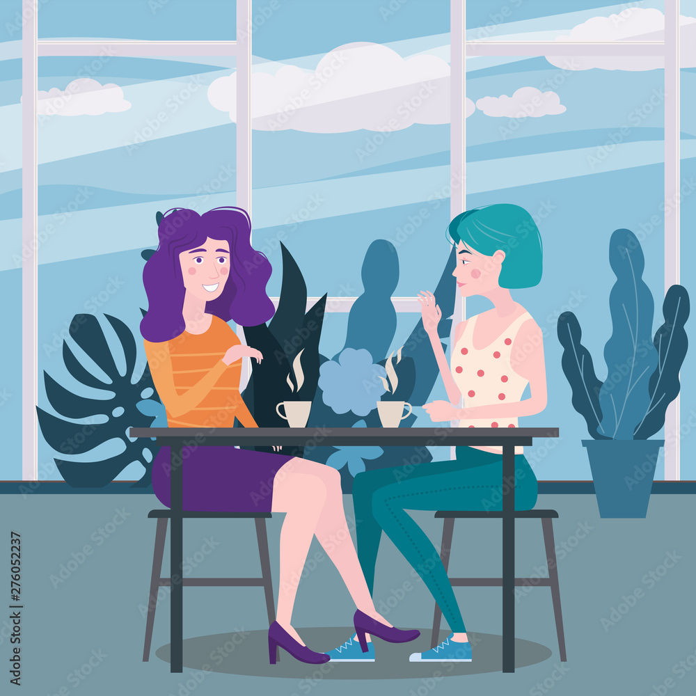 Loving couple is drinking coffee in cafe. A man and a woman in love on date are sitting at a table