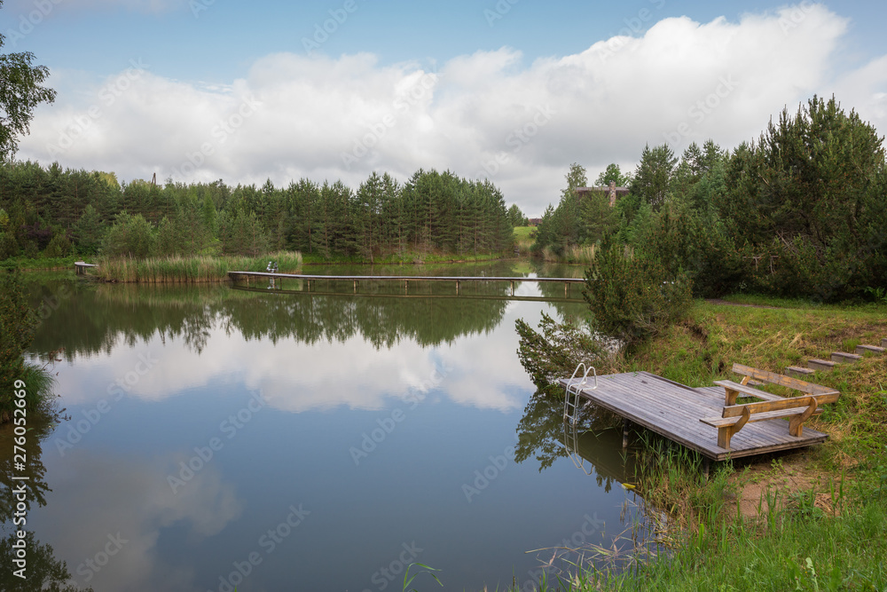 City Amatciems, Latvian republic. A clean lake and surrounded by green nature. Recreation area for tourists. Travel photo 14. Jun. 2019 City Amatciems, Latvian republic. A clean lake and surrounded by green nature. Recreation area for tourists. Travel photo 14. Jun. 2019
