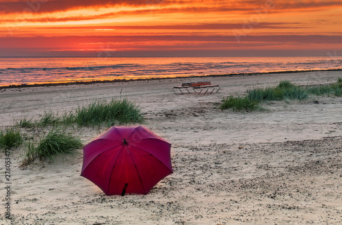 Summer sunrise on sandy beach of Jurmala - famous Baltic tourist  resort in Latvia  Europe. Summer vacation concept