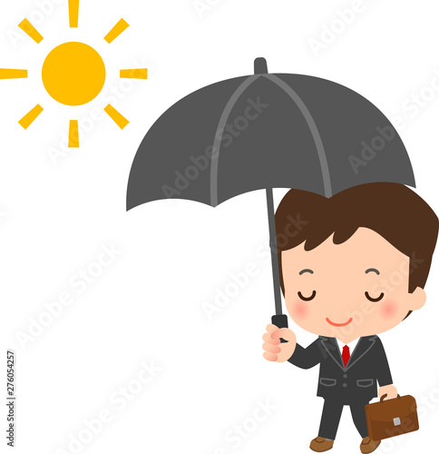 日傘をさして歩くスーツの男性