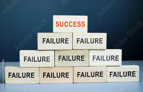 Success and failure concept. Career staircase from wooden blocks. photo