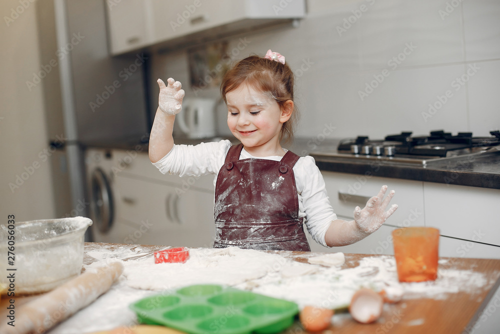 Child in a kitchen. Little girl with a dough. Child in a kitchen. Little girl with a dough.
