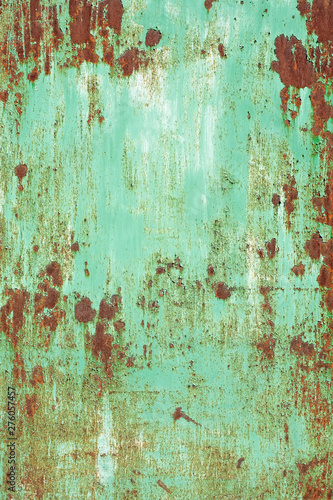 old rusty metal peeling off painted surface texture with spots closeup view