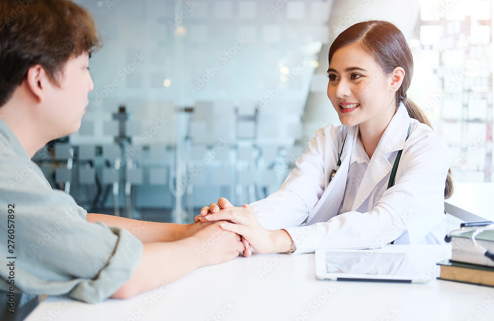 Fototapeta premium Healthcare technology concept.Woman Doctor Working using a laptop computer contact with patient.