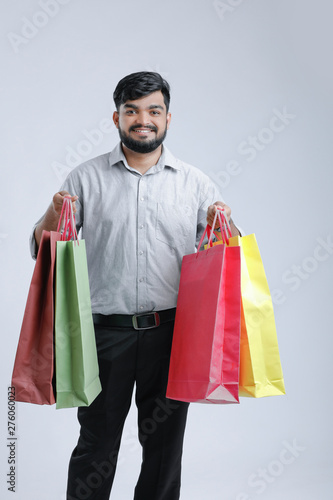 Young indian man with shopping bags