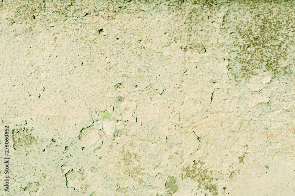 Grunge old painted wall of the house close up green color toned. Abstract background