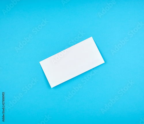 white rectangular paper envelope on a blue background