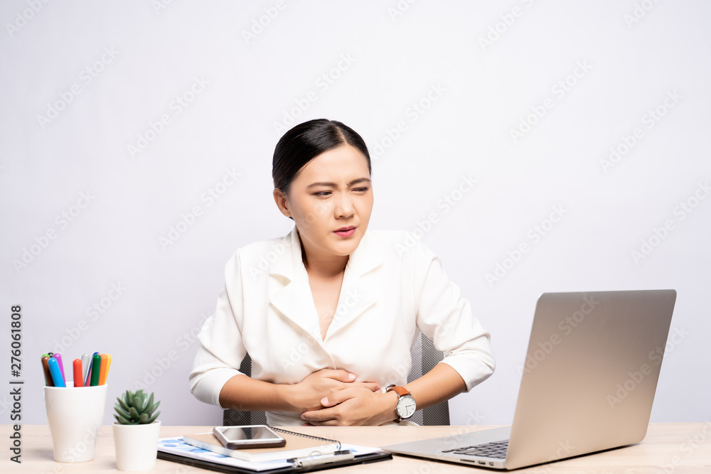 Woman has stomachache at office isolated white background
