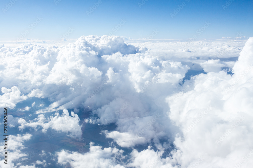 Fototapeta premium Clouds and sky from airplane window view