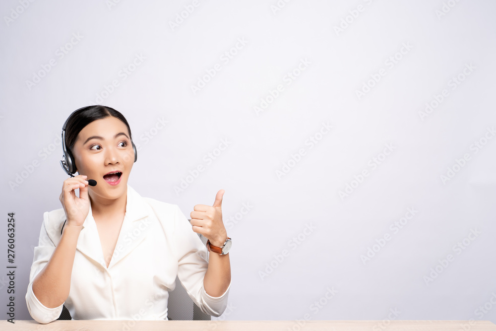 Woman operator in headset with blank copy space isolated white background Woman operator in headset with blank copy space isolated white background