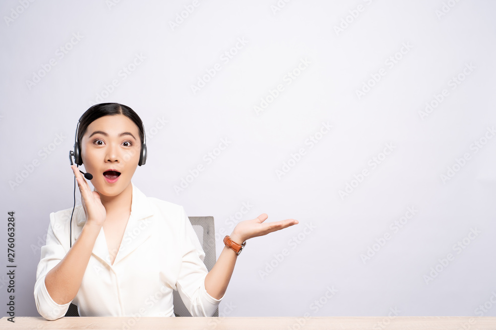 Woman operator in headset with blank copy space isolated white background Woman operator in headset with blank copy space isolated white background