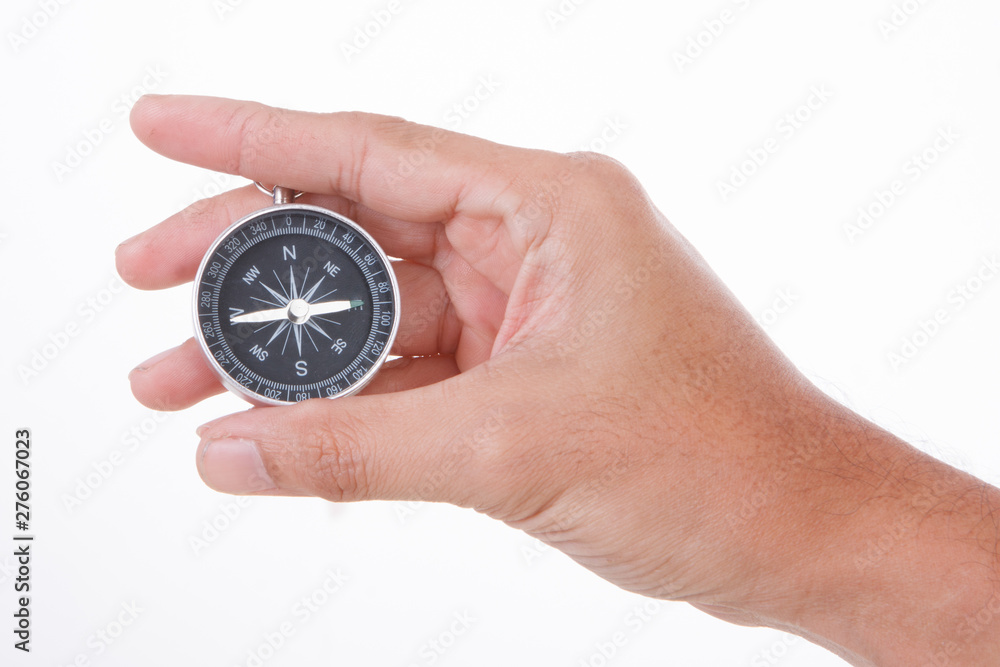 Hand Holding Compass ISOLATED ON WHITE BACKGROUND. Hand Holding Compass ISOLATED ON WHITE BACKGROUND.