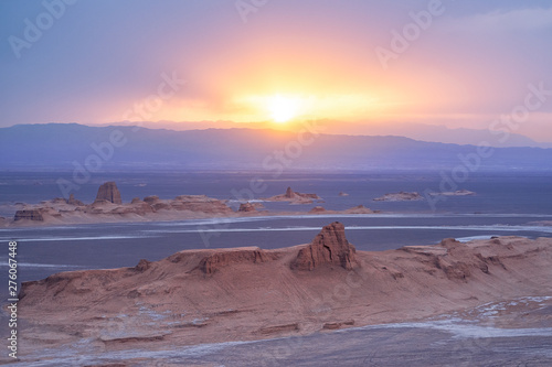 unsurpassed landscapes of sandy rocks with sunset above the desert in Lut desert,hottest desert in the world, also known like Kalut Desert photo