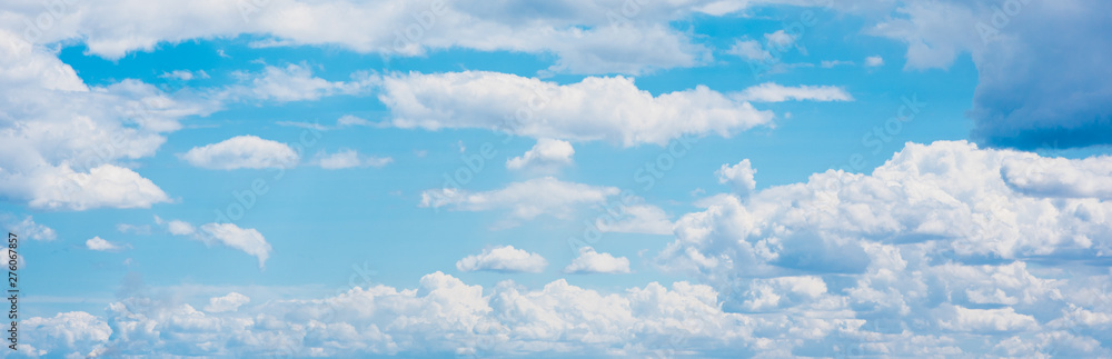 Beautiful white cumulonimbus clouds against the background of the bright blue sky Beautiful white cumulonimbus clouds against the background of the bright blue sky
