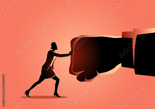 Businesswoman holding a giant fist