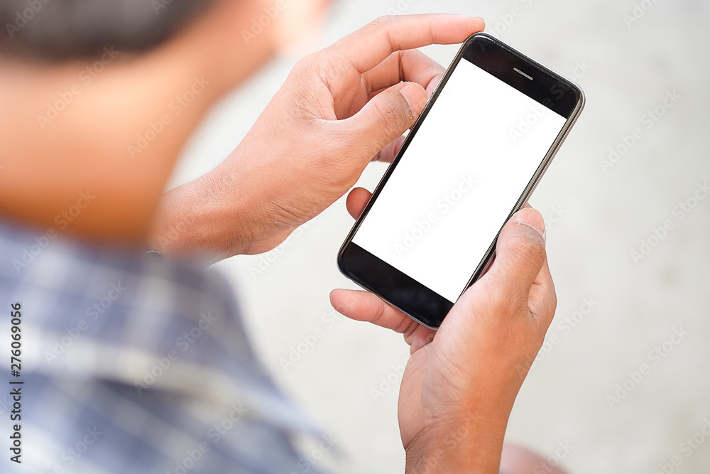 Cropped shot view of man hands holding smart phone with blank copy space screen for your text message or information content, female reading text message on cell telephone during in urban setting. Cropped shot view of man hands holding smart phone with blank copy space screen for your text message or information content, female reading text message on cell telephone during in urban setting.